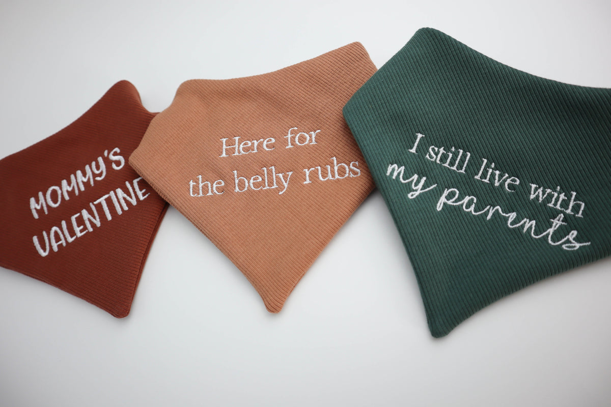 Three dog bandanas with humorous text on a white background