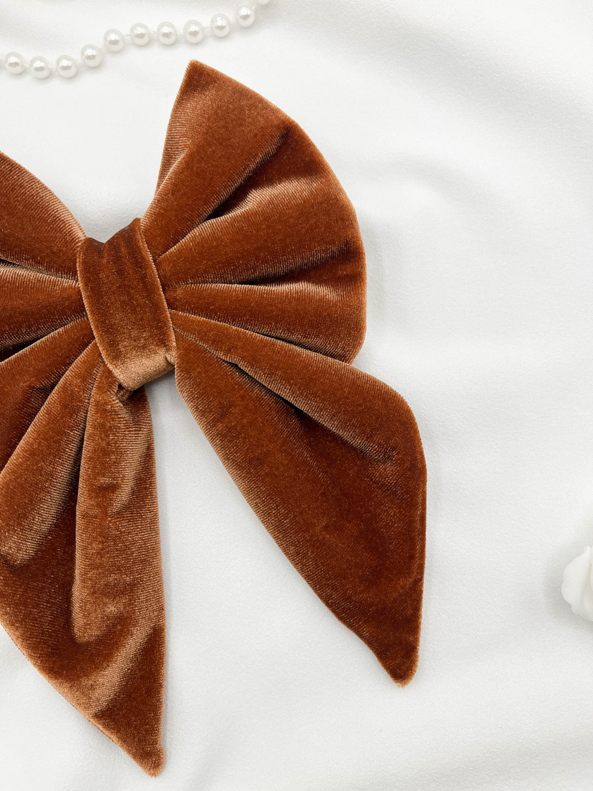 Brown velvet bow on a white background